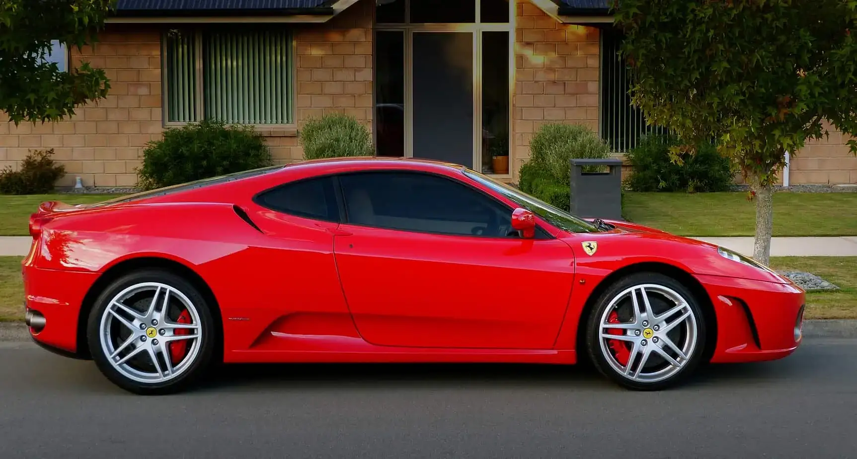 Barrie exotic car on flatbed soft-strap transport