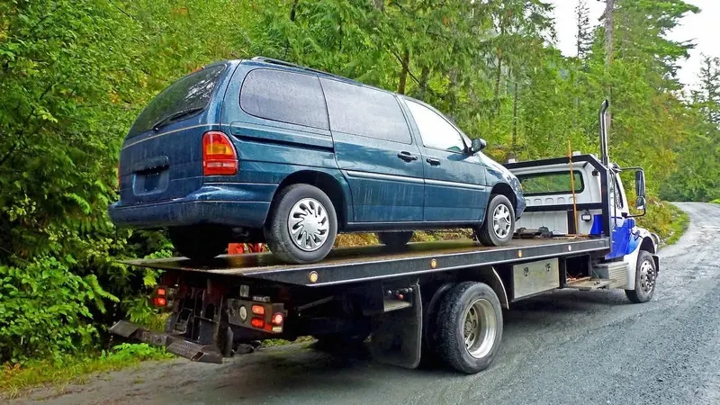 Barrie flatbed towing a cargo van